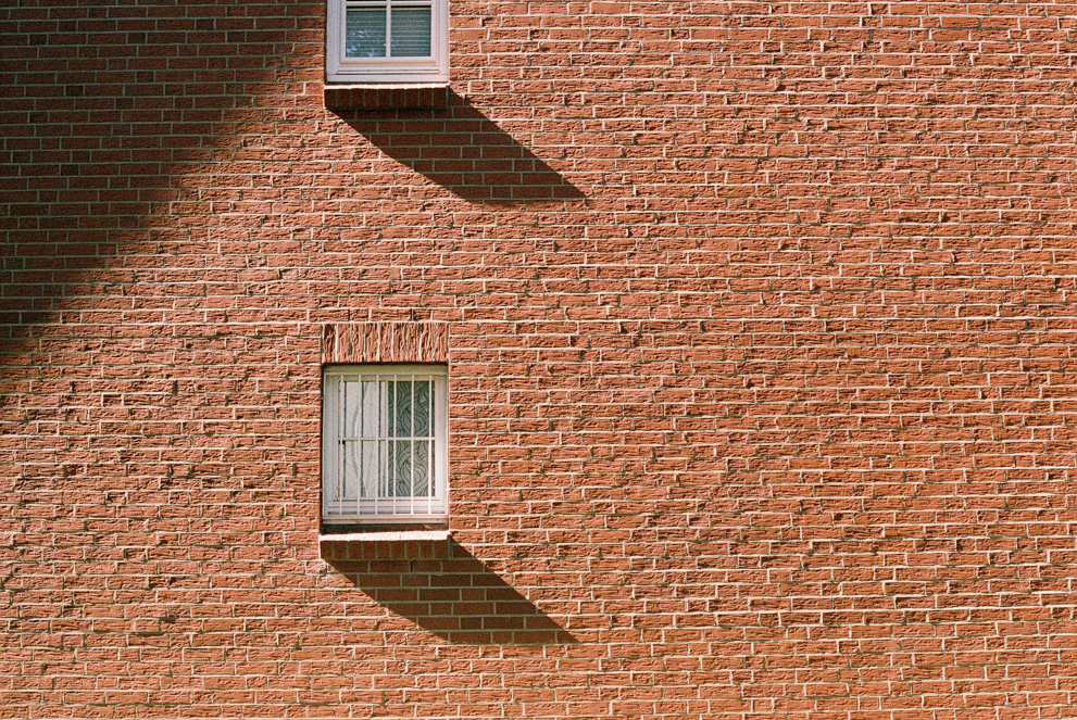 A brick wall with gracing indicent sun light. Shot on Fujifilm Superia X-tra 400.