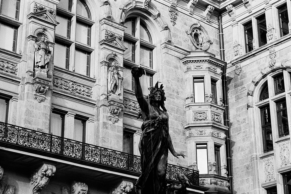 Water fountain in the patio of the Hamburg city hall. Shot in Ilford Delta 100