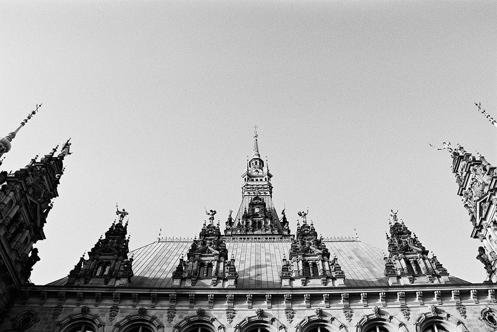 The roof and towers of the Hamburg city hall. Shot in Ilford Delta 100